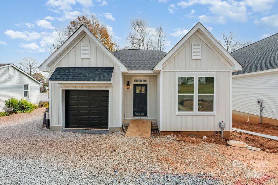 Front exterior of a new home in , Lowell, NC, highlighting curb appeal (Image 1). Front exterior of a new home in , Lowell, NC, highlighting curb appeal (Image 1).