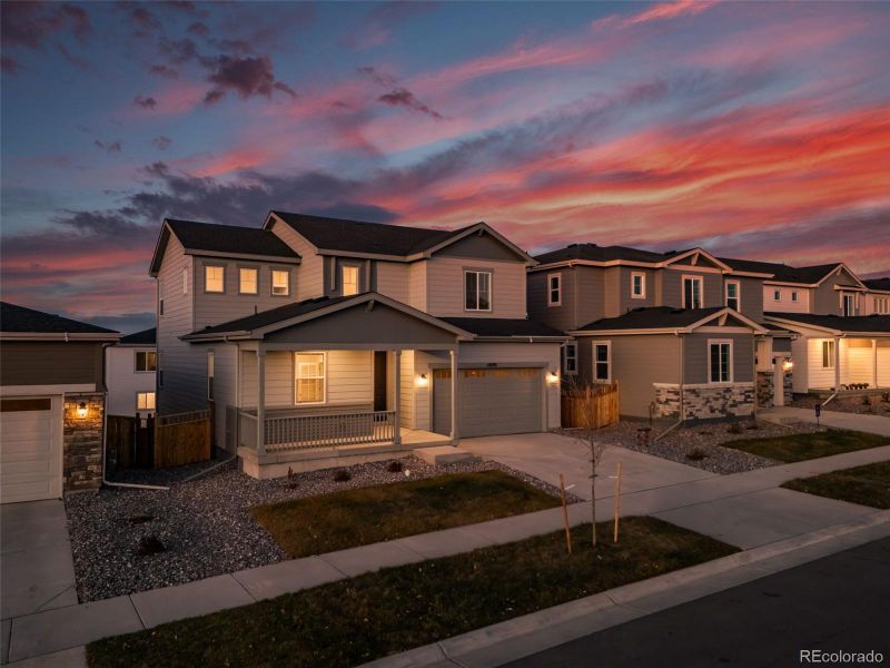 Front exterior of a new home in Floret Collection at Alder Creek, Parker, CO, highlighting curb appeal (Image 1).