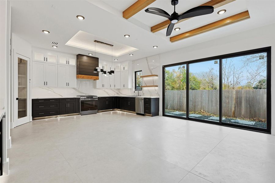 High ceilings and white walls throughout the home provide a clean, neutral interior.