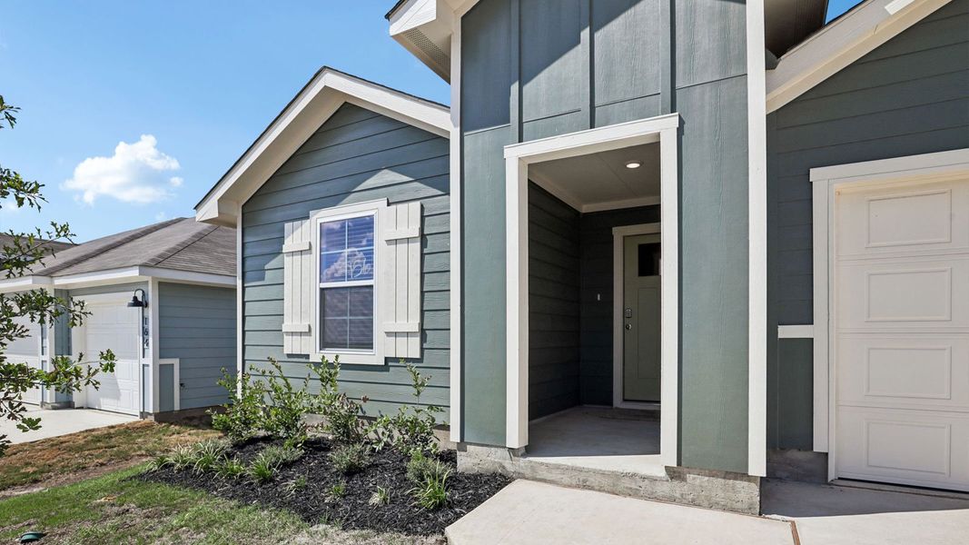 Exterior details and patio area of a home in Prairie Lakes, Buda (Image 3).