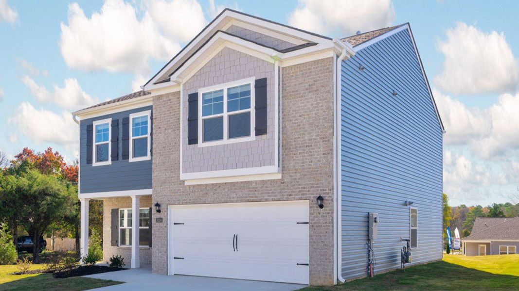 Front exterior of a new home in Hillcrest Landing, McDonald, TN, highlighting curb appeal (Image 14).