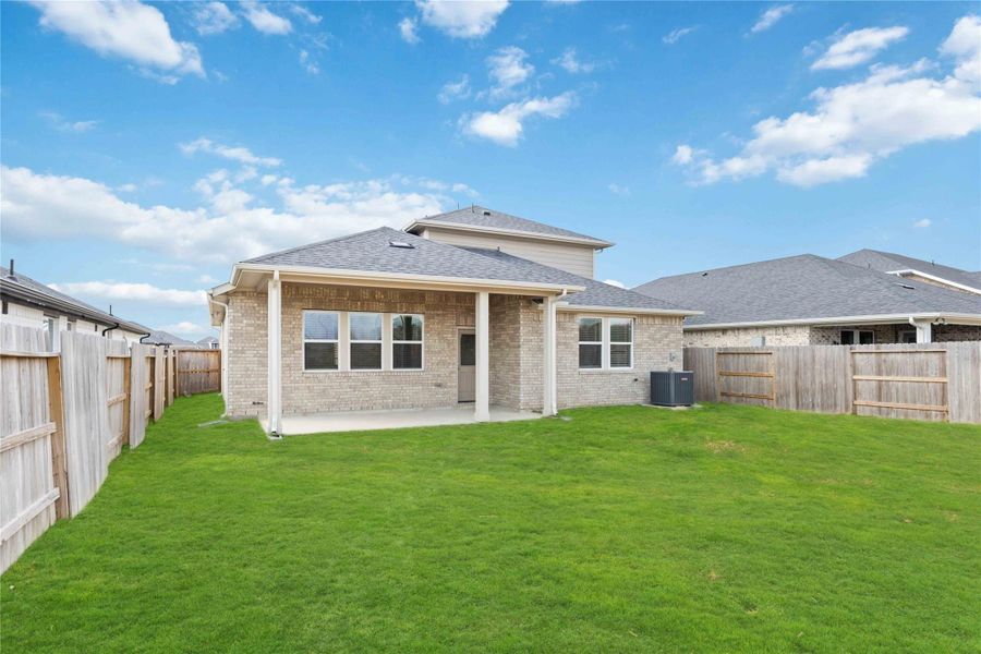 Exterior details and patio area of a home in Sunterra, Katy (Image 4).