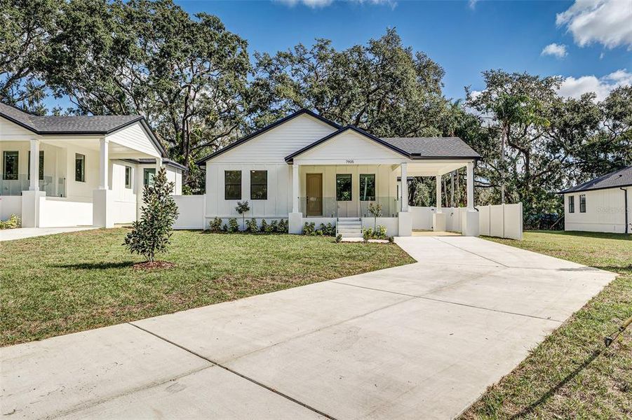 Front exterior of a new home in , Tampa, FL, highlighting curb appeal (Image 23).