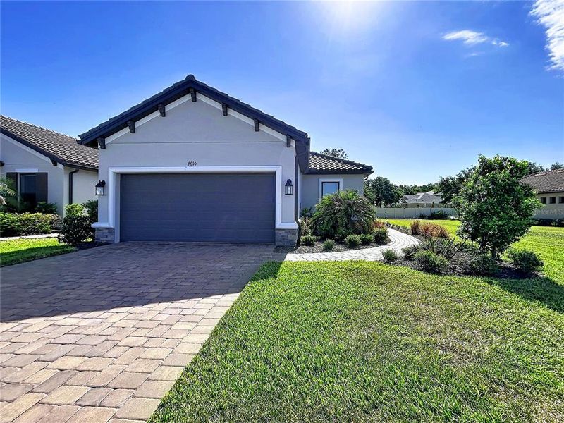 Front exterior of a new home in , Wesley Chapel, FL, highlighting curb appeal (Image 33).