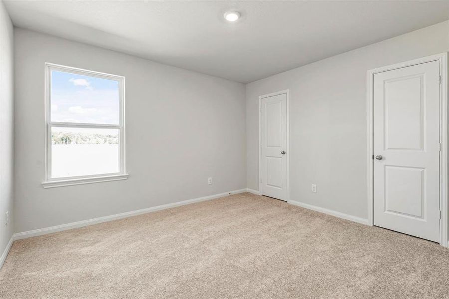 Even the secondary bedroom is spacious and full of natural light.