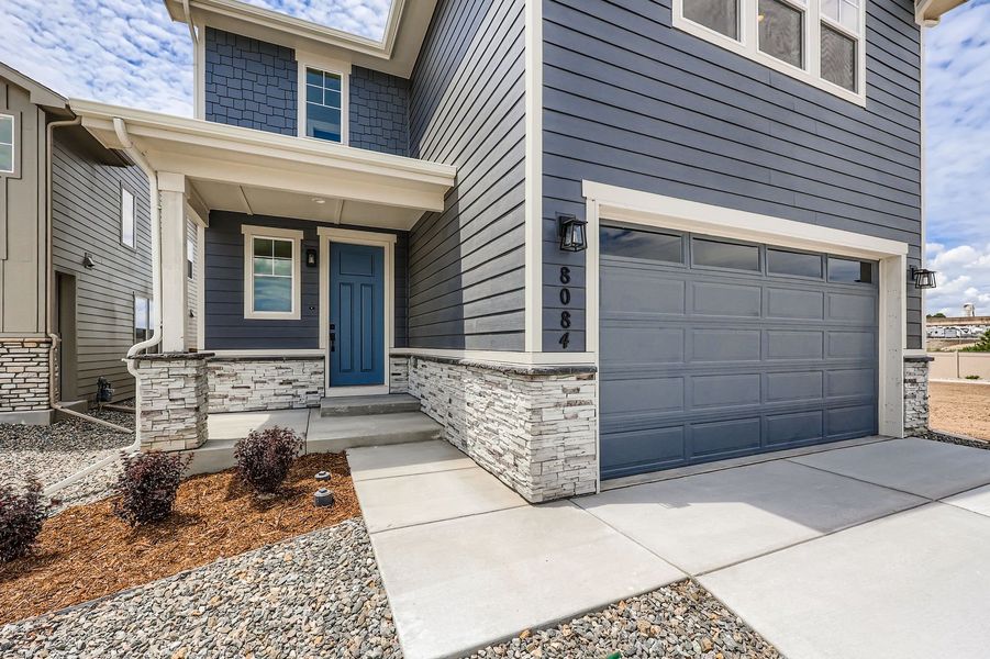 Front exterior of a new home in Sterling Ranch 40s, Colorado Springs, CO, highlighting curb appeal (Image 18). Front exterior of a new home in Sterling Ranch 40s, Colorado Springs, CO, highlighting curb appeal (Image 18).