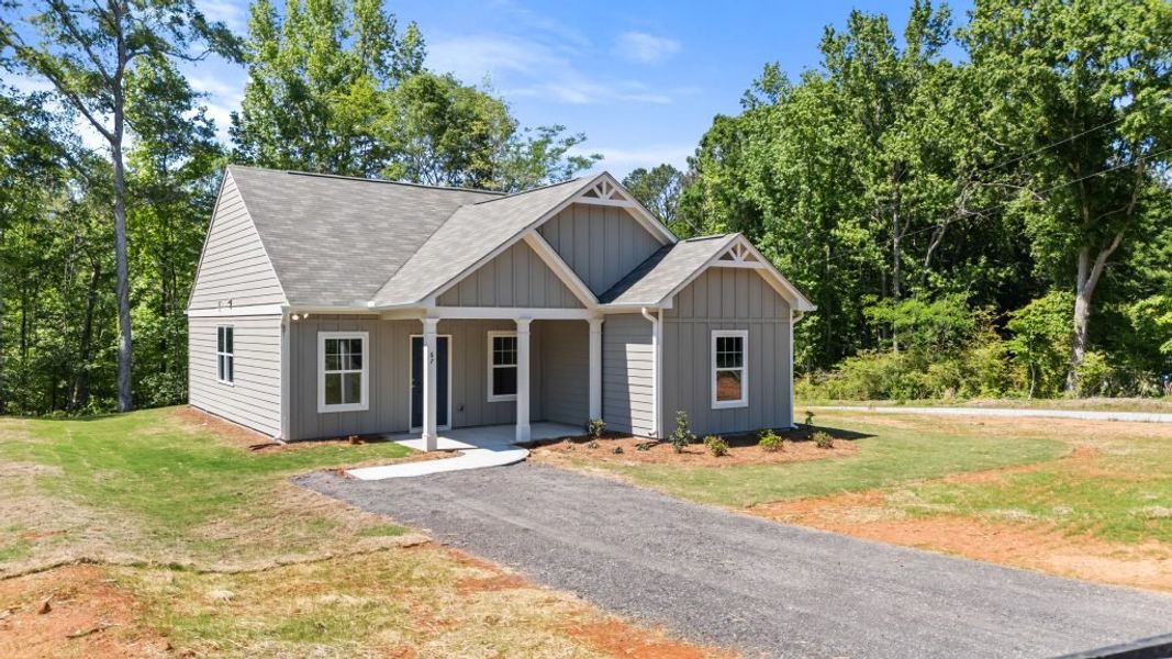 Front exterior of a new home in Clemit Harris Place, Newnan, GA, highlighting curb appeal (Image 4). Front exterior of a new home in Clemit Harris Place, Newnan, GA, highlighting curb appeal (Image 4).