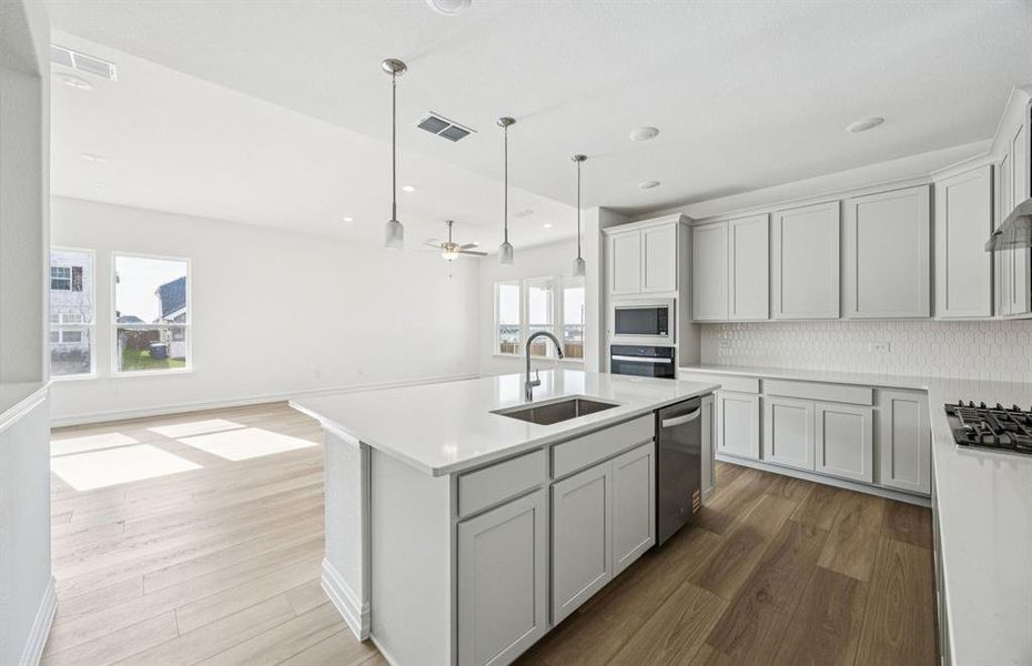 Pendant and recessed lighting in kitchen