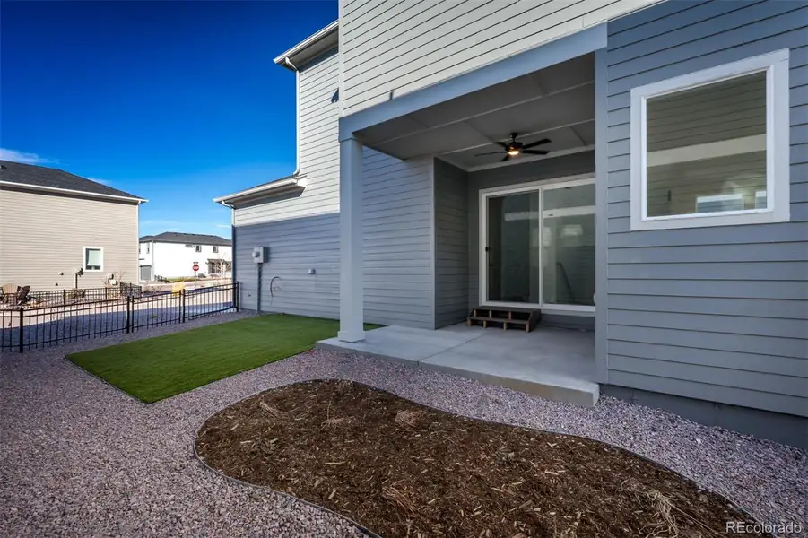 Exterior details and patio area of a home in Revel Crossing at Wolf Ranch – The Outlook Collection, Colorado Springs (Image 3).