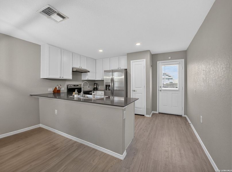 Furnished interior view inside a new home in Mission del Lago, San Antonio (Image 19).