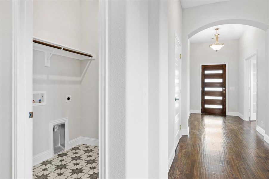 Entrance foyer featuring arched walkways and baseboards Entrance foyer featuring arched walkways and baseboards