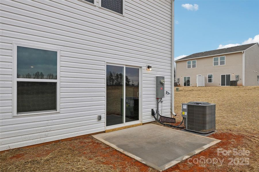Exterior details and patio area of a home in The Towns at Green Needles, Lexington (Image 9).