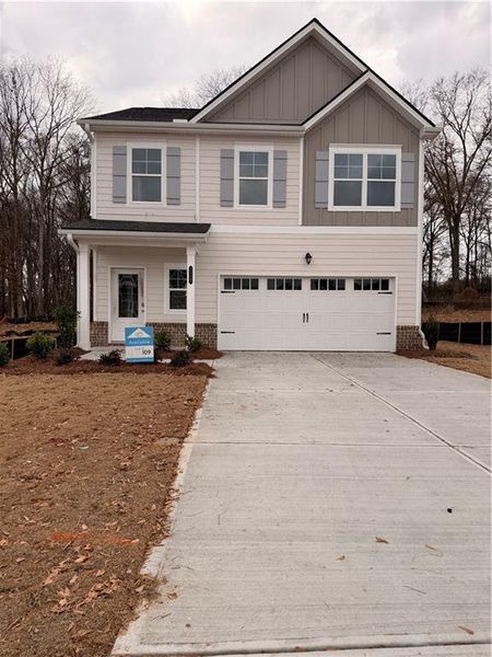Front exterior of a new home in Neely Farm, Covington, GA, highlighting curb appeal (Image 1). Front exterior of a new home in Neely Farm, Covington, GA, highlighting curb appeal (Image 1).