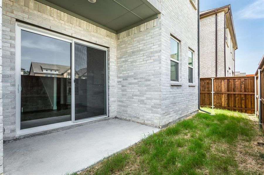 Doorway to property featuring a patio area