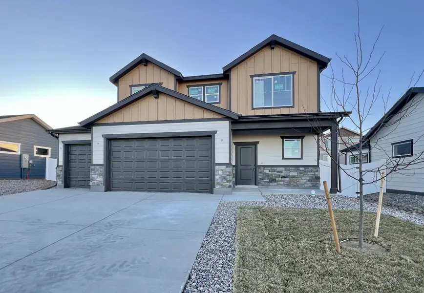 Front exterior of a new home in Union Colony West, Greeley, CO, highlighting curb appeal (Image 2). Front exterior of a new home in Union Colony West, Greeley, CO, highlighting curb appeal (Image 2).