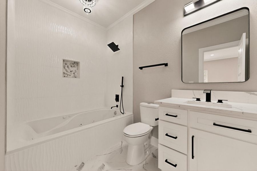 Upstairs Full Bathroom featuring combined bath / shower with jetted tub, crown molding, Upstairs Full Bathroom featuring combined bath / shower with jetted tub, crown molding,