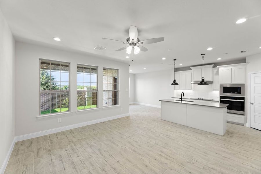 Front exterior of a new home in Main Street Village, Mansfield, TX, highlighting curb appeal (Image 6).