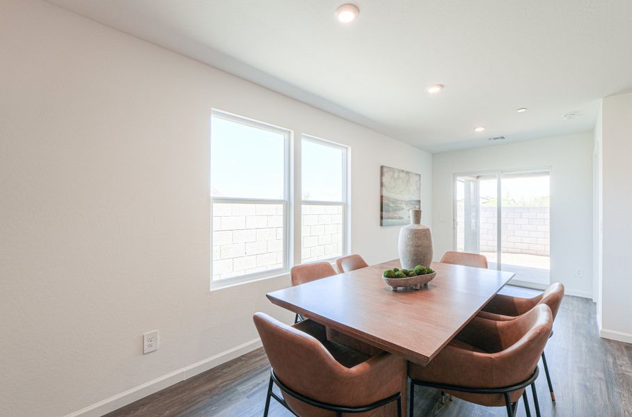 A dining room table with chairs. A dining room table with chairs.