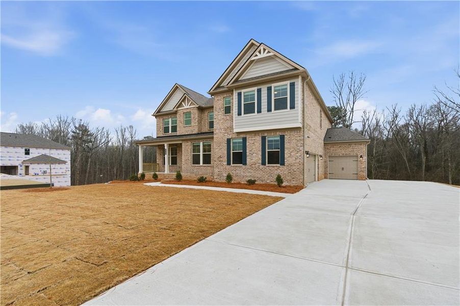 Front exterior of a new home in Trinity Park, McDonough, GA, highlighting curb appeal (Image 1). Front exterior of a new home in Trinity Park, McDonough, GA, highlighting curb appeal (Image 1).