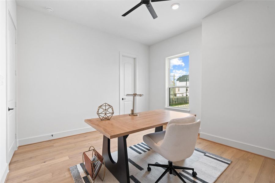This versatile second-floor bedroom includes a full walk-in closet, offering ample storage and flexibility for use as a office, or media space.