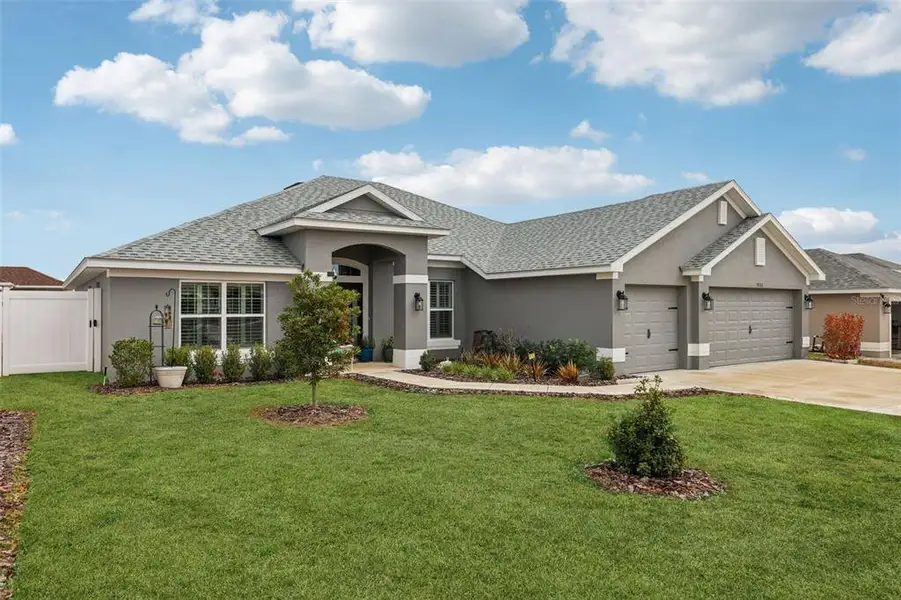 Front exterior of a new home in Oaks at Ocala Crossings, Ocala, FL, highlighting curb appeal (Image 2).
