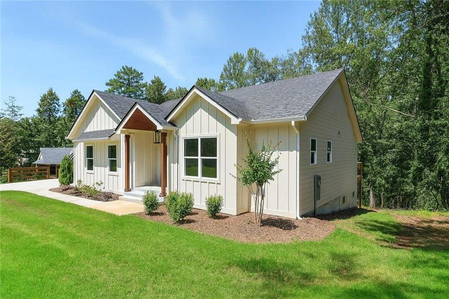 Front exterior of a new home in , Gainesville, GA, highlighting curb appeal (Image 19). Front exterior of a new home in , Gainesville, GA, highlighting curb appeal (Image 19).