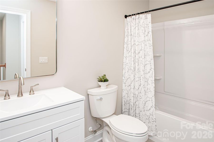 Full bathroom located in bonus room.