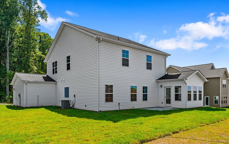 Front exterior of a new home in Brooke Hill, Lewisville, NC, highlighting curb appeal (Image 26). Front exterior of a new home in Brooke Hill, Lewisville, NC, highlighting curb appeal (Image 26).