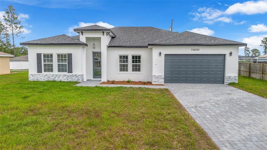 Front exterior of a new home in , Ocala, FL, highlighting curb appeal (Image 1). Front exterior of a new home in , Ocala, FL, highlighting curb appeal (Image 1).
