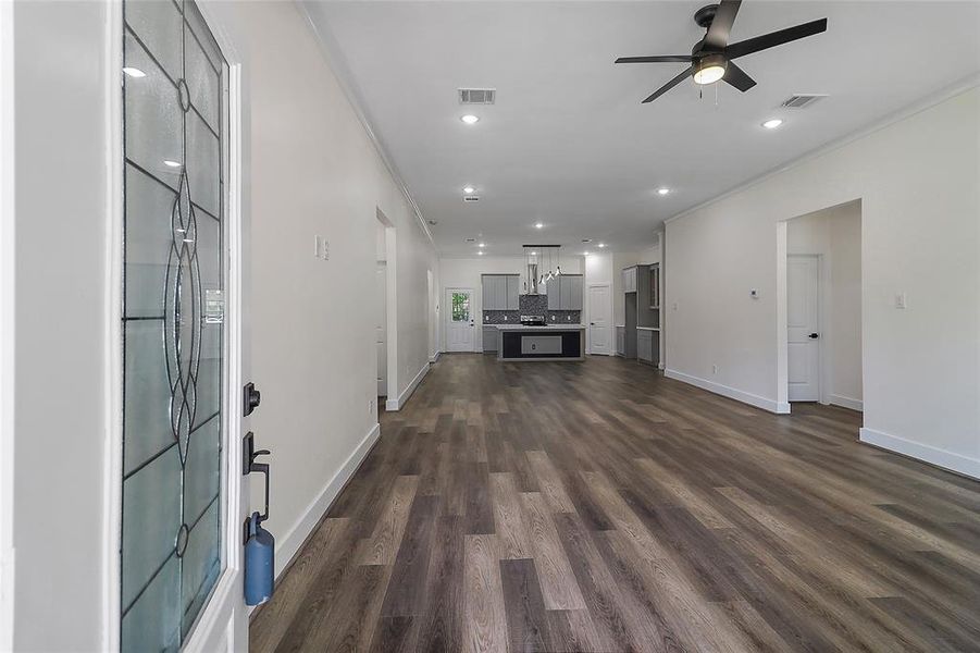 Upon entry, you're greeted by a warm inviting open concept with soaring ceiling that sets the tone for the spaciousness and luxury found throughout.