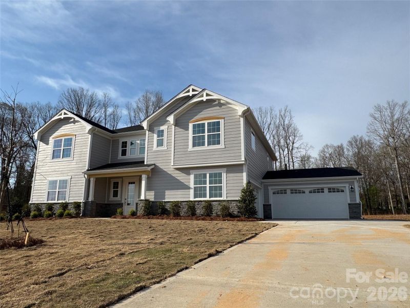 Front exterior of a new home in Blair Place, Monroe, NC, highlighting curb appeal (Image 10).