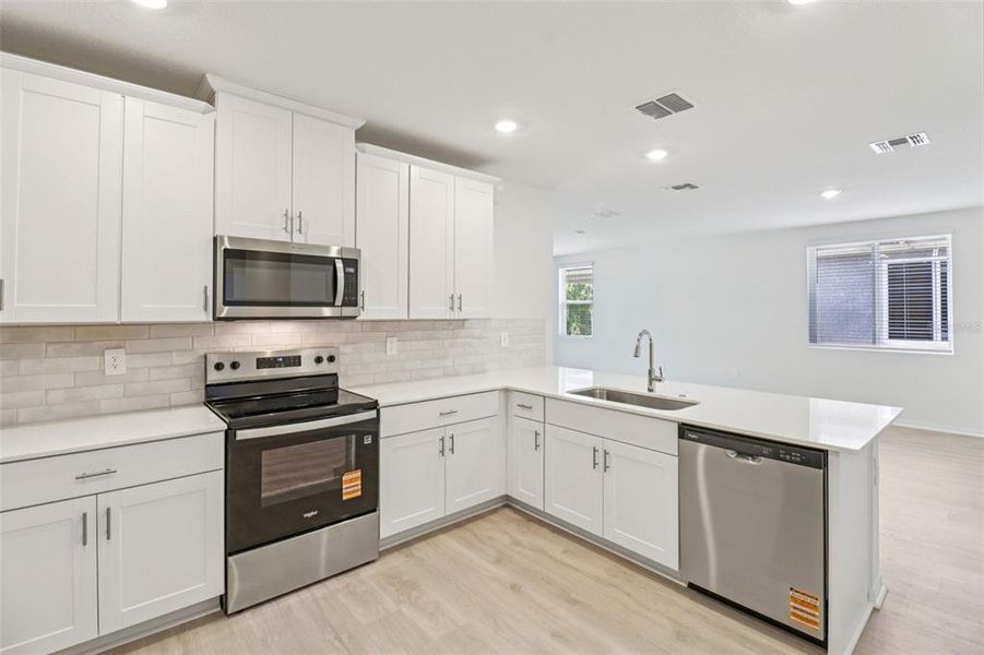 Furnished interior view inside a new home in Ridgehaven - Villas, Ormond Beach (Image 6).