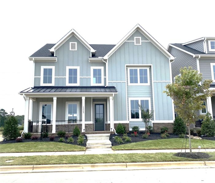 Front exterior of a new home in , Davidson, NC, highlighting curb appeal (Image 1).