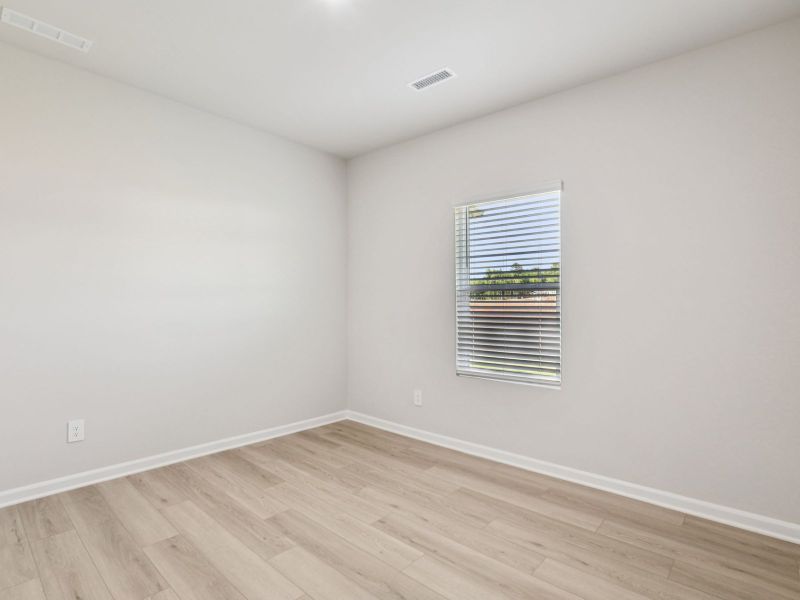 Secondary bedroom in the Paisley floorplan at a Meritage Homes community in Garner, NC.