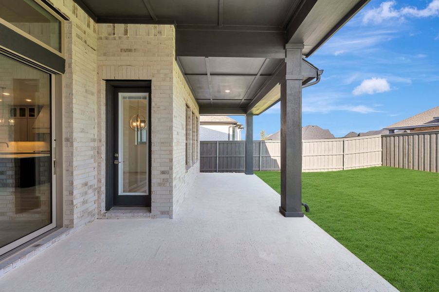 Exterior details and patio area of a home in Goodland – Manor Series, Grand Prairie (Image 3). Exterior details and patio area of a home in Goodland – Manor Series, Grand Prairie (Image 3).