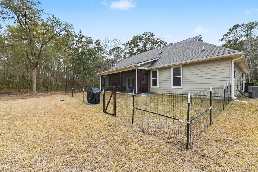 Exterior details and patio area of a home in , Johns Island (Image 23).