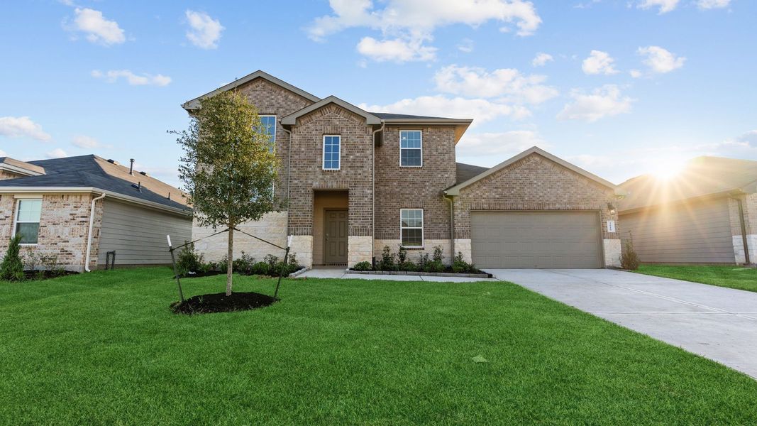 Front exterior of a new home in Tamarron, Fulshear, TX, highlighting curb appeal (Image 1). Front exterior of a new home in Tamarron, Fulshear, TX, highlighting curb appeal (Image 1).