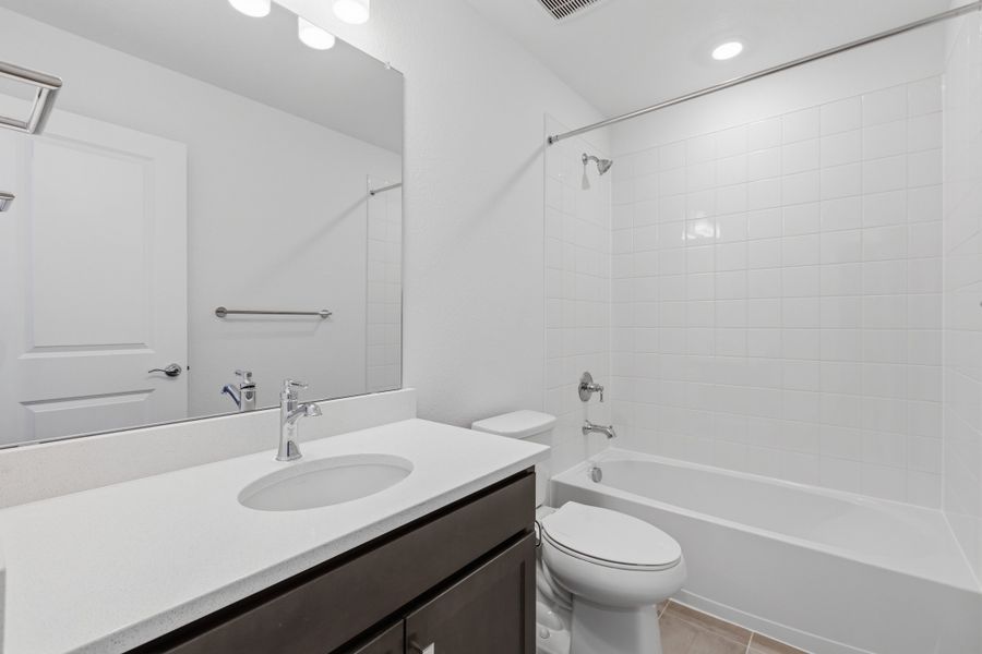 Furnished interior view inside a new home in Woodrose at Painted Prairie, Aurora (Image 9).