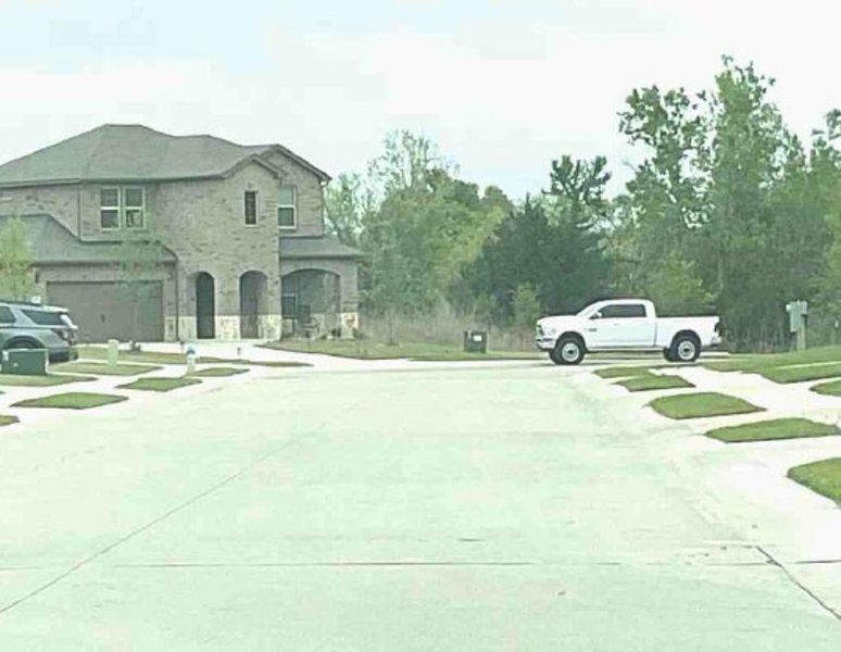 Front exterior of a new home in Woodcreek, Fate, TX, highlighting curb appeal (Image 1). Front exterior of a new home in Woodcreek, Fate, TX, highlighting curb appeal (Image 1).