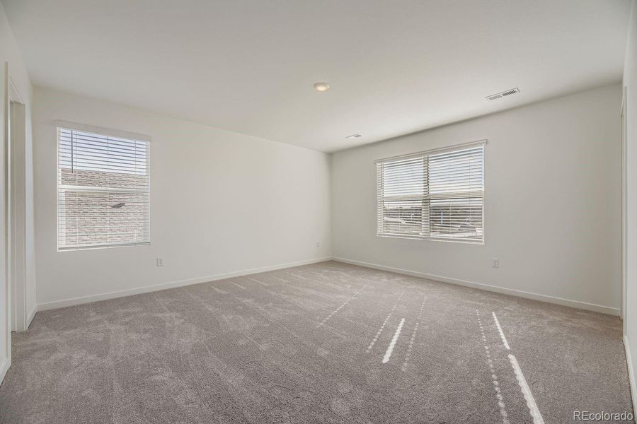 Spacious, unfurnished interior of a new home in Eastcreek Farm: The Camden Collection, Thornton (Image 8).