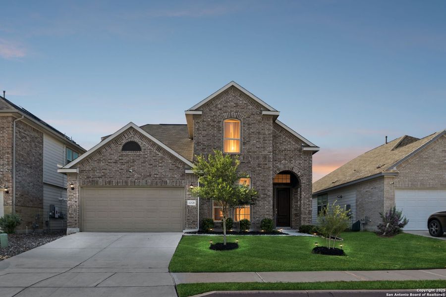 Front exterior of a new home in Rhine Valley, Schertz, TX, highlighting curb appeal (Image 25).