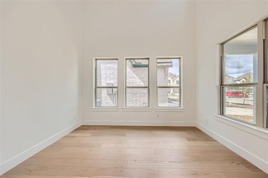 Spare room featuring light wood-type flooring