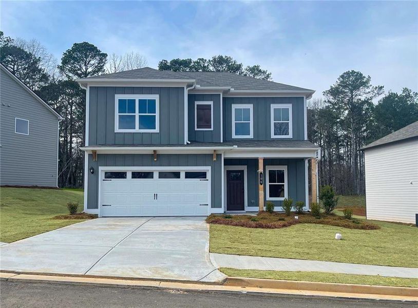 Front exterior of a new home in Summerfield Place, Carrollton, GA, highlighting curb appeal (Image 1). Front exterior of a new home in Summerfield Place, Carrollton, GA, highlighting curb appeal (Image 1).