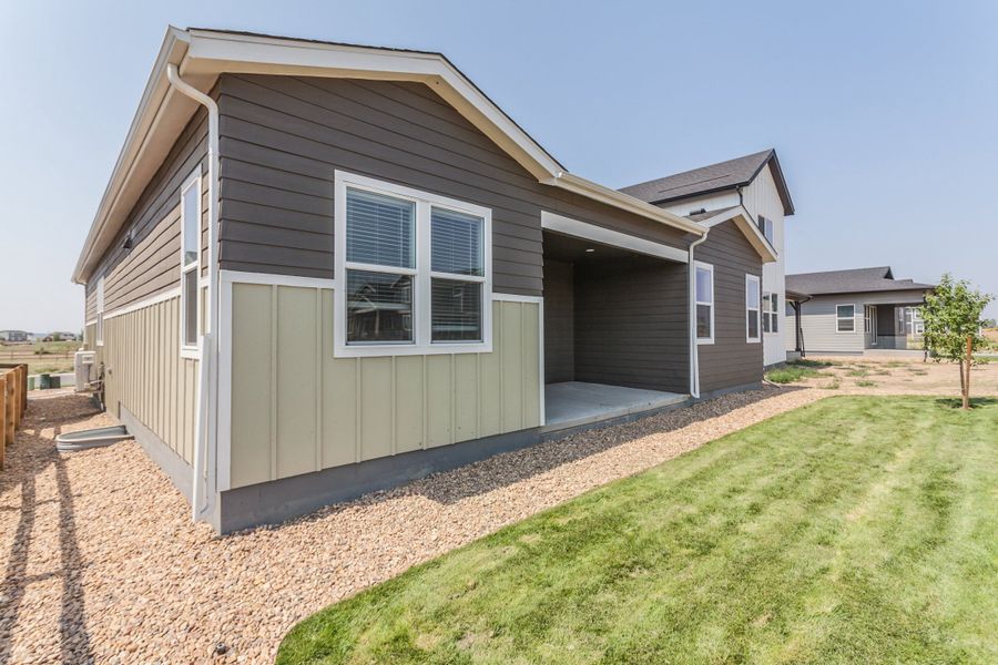 Exterior details and patio area of a home in Prairie Song, Windsor (Image 28).