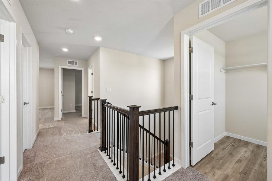 A hallway with white doors.