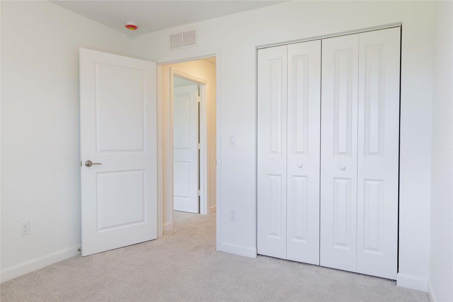 Another perspective of bedroom #2 shows the ample closet space