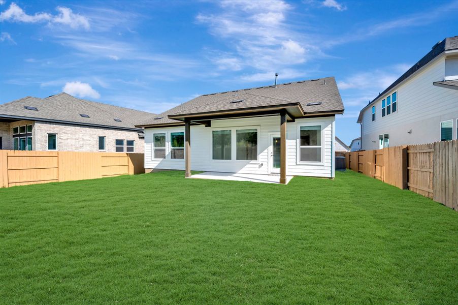 Exterior details and patio area of a home in The Colony, Bastrop (Image 3).