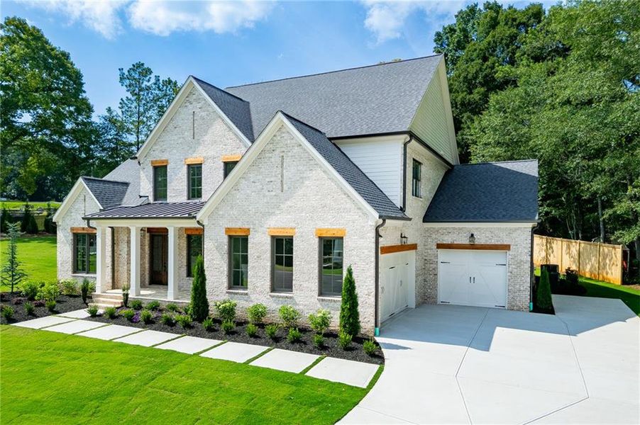 Front exterior of a new home in , Buford, GA, highlighting curb appeal (Image 33).