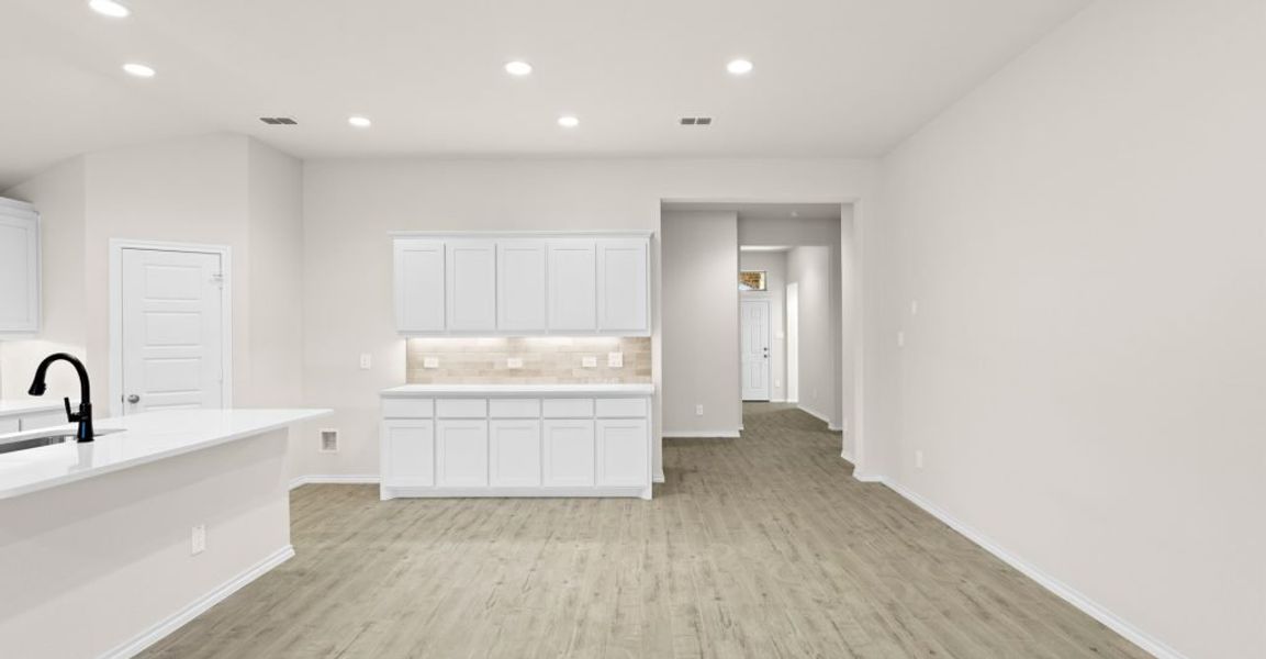 Representative exterior photo of a completed home built from the Austin by Impression Homes in Keeneland, Aubrey, TX (Image 7).