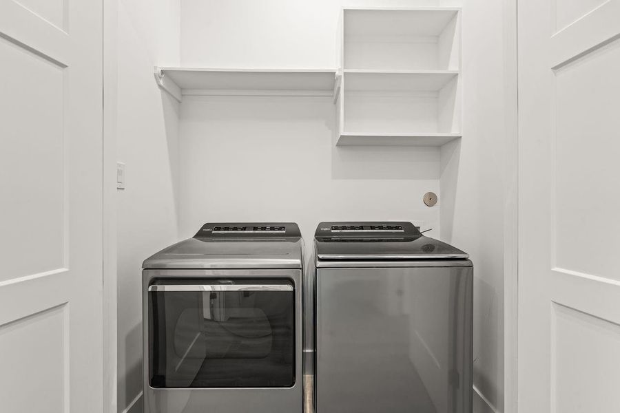 A well-functioning home is measured as much by its supporting spaces as its gathering areas. Organized storage and a dedicated laundry room contribute to a layout that is both efficient and easy to live in.